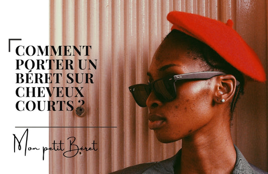 femme a la peau noire avec les cheveux court portant un béret rouge et des lunettes de soleil